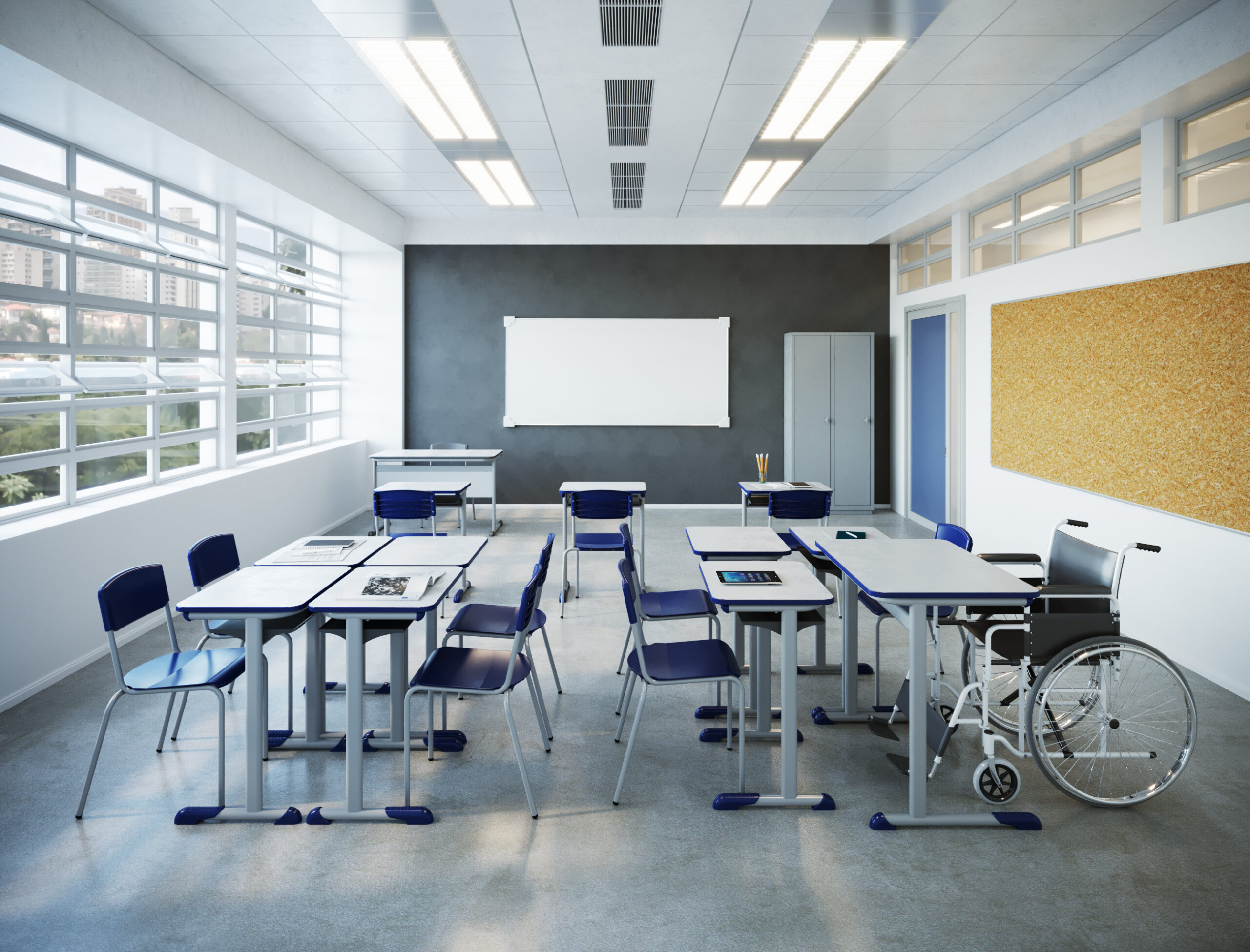 Sala de aula com lousa branca e móveis escolares nas cores azul e cinza