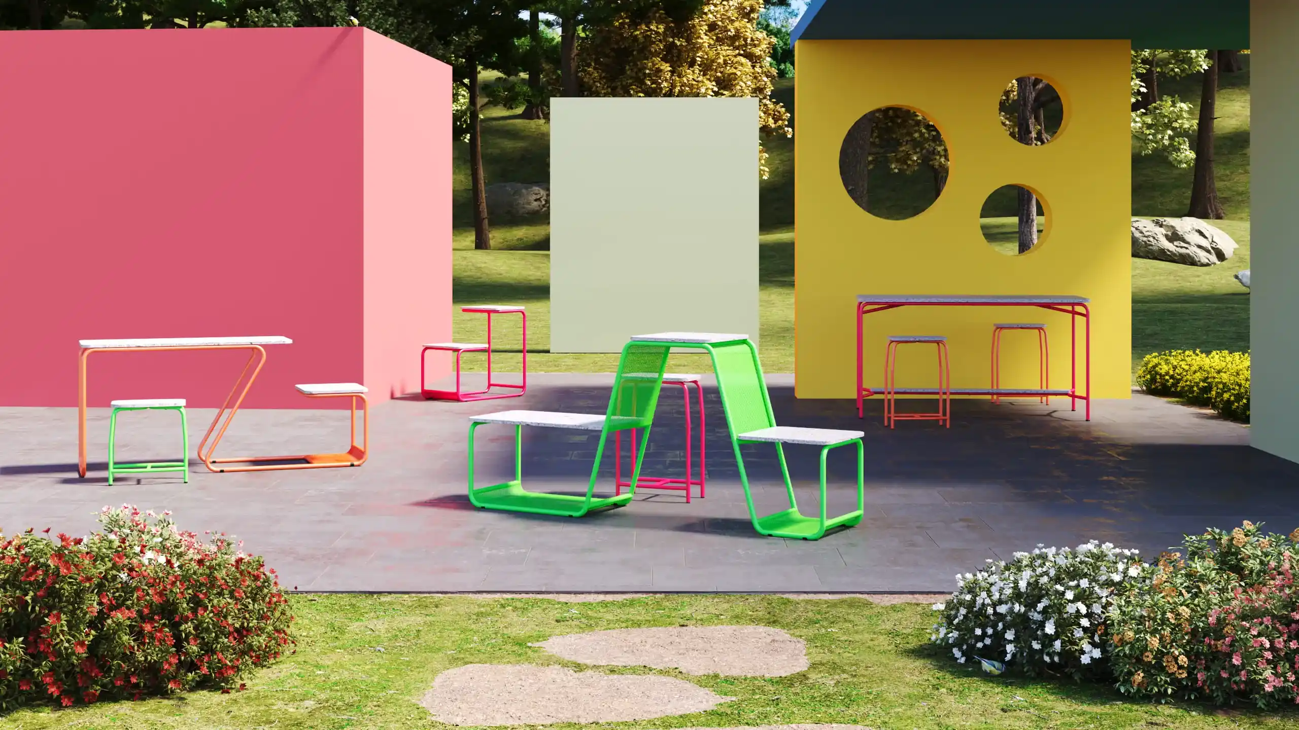 ambiente externo com vegetação ao fundo, paredes coloridas e móveis coloridos à frente das paredes