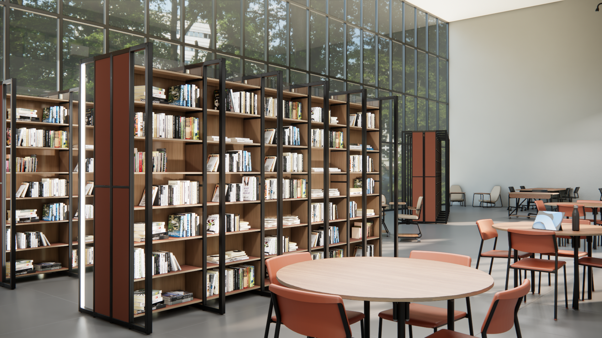 Ambiente com estantes para biblioteca Flip, mesas redondas e cadeiras.